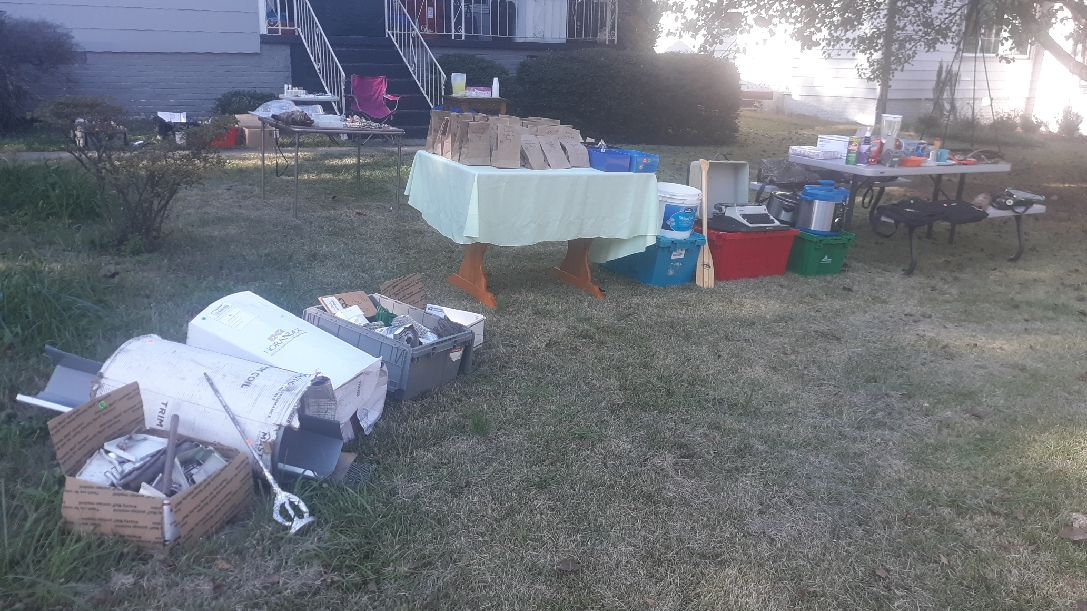 Yard sale with clothes, shoes, kitchen, jewelry, makeup, tools, mystery bags, gutter supplies.