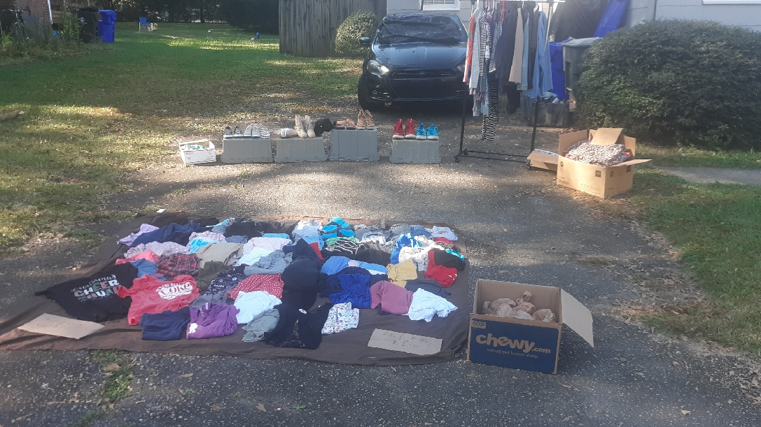 Yard sale with clothes, shoes, kitchen, jewelry, makeup, tools, mystery bags, gutter supplies.